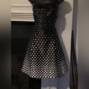 Polka dot tulle bottom lining strapless with a bow perfect holiday dress
